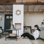 woman sitting on the floor using a laptop